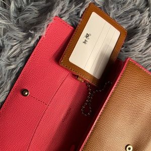 COACH  trifold wallet with ID chain.